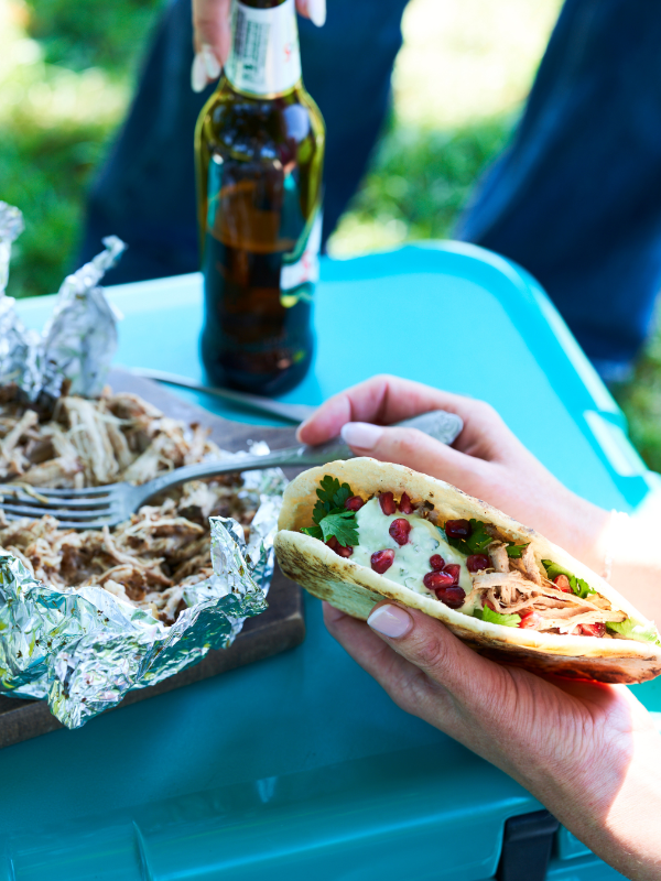 BBQ pulled pork shawarma pita breads with garlic skyr & pomegranate seeds